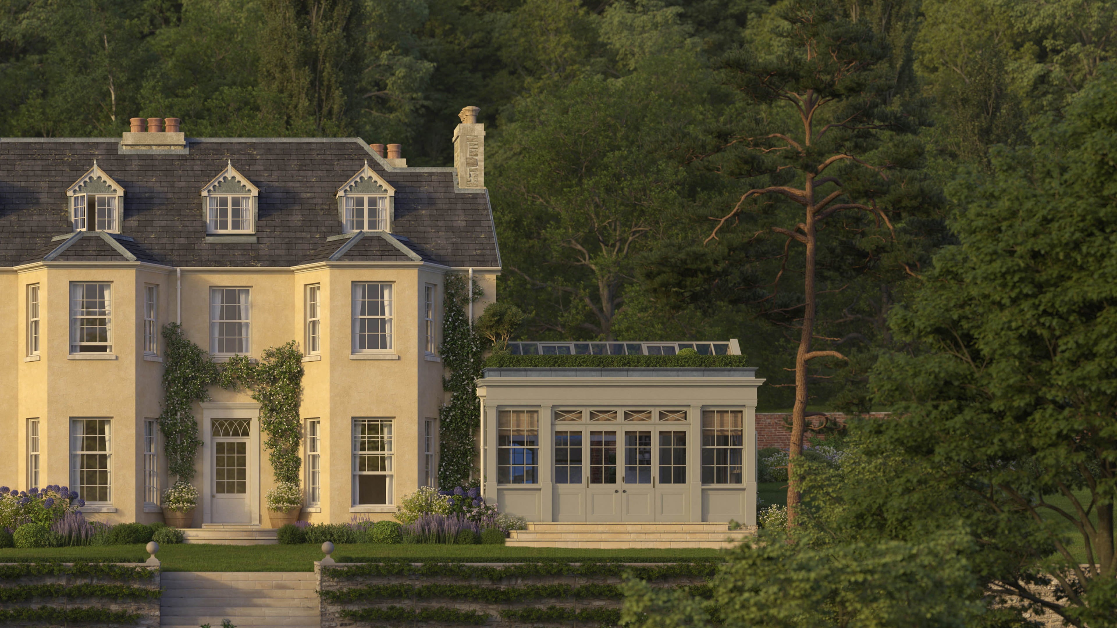 Victorian-style house with pale yellow stucco, slate roof, intricate gable details, and lush greenery surrounding the garden