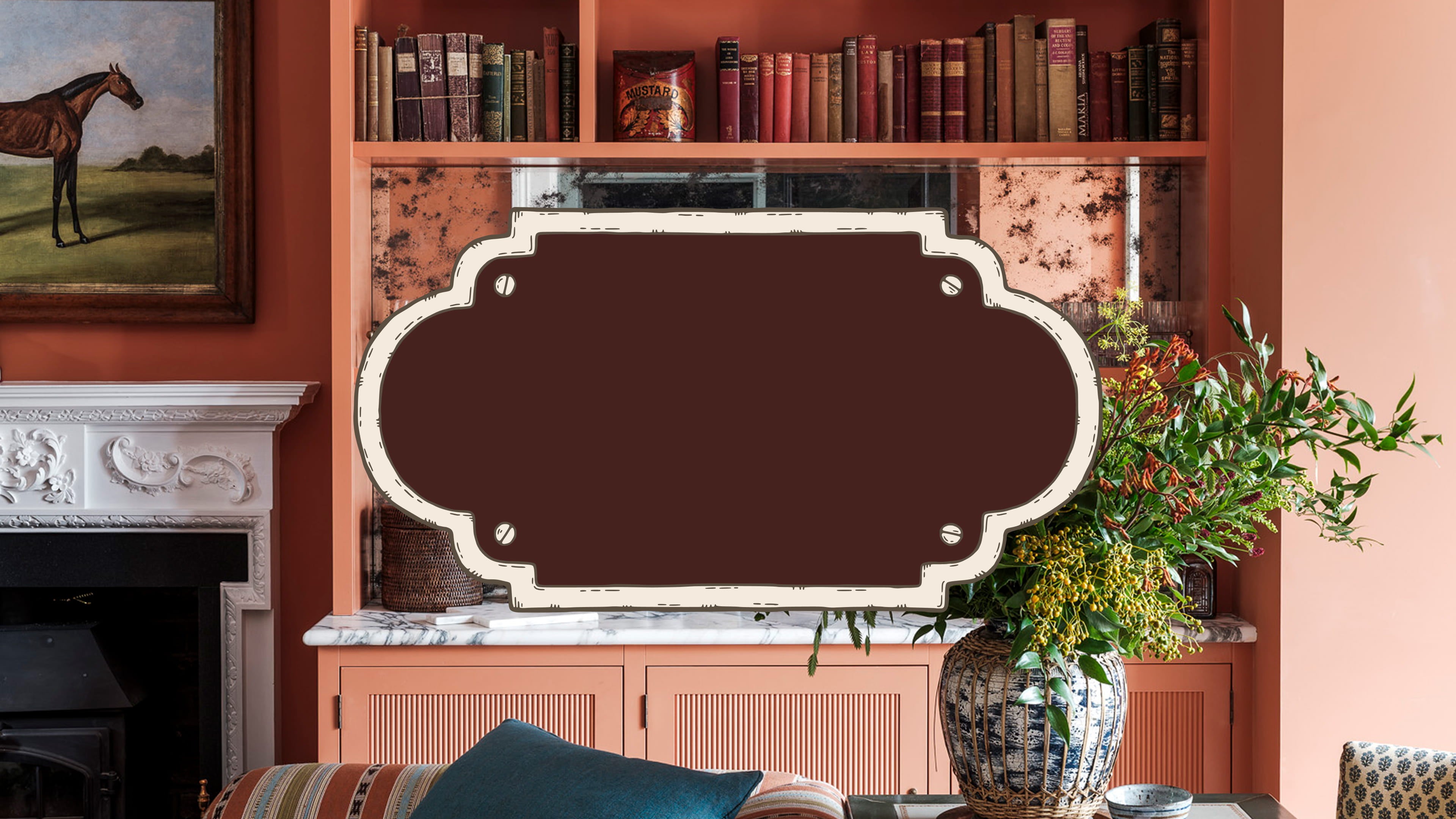Warm terracotta walls with a vintage oil painting, fluted plaster fireplace, and an array of antique books on shelves